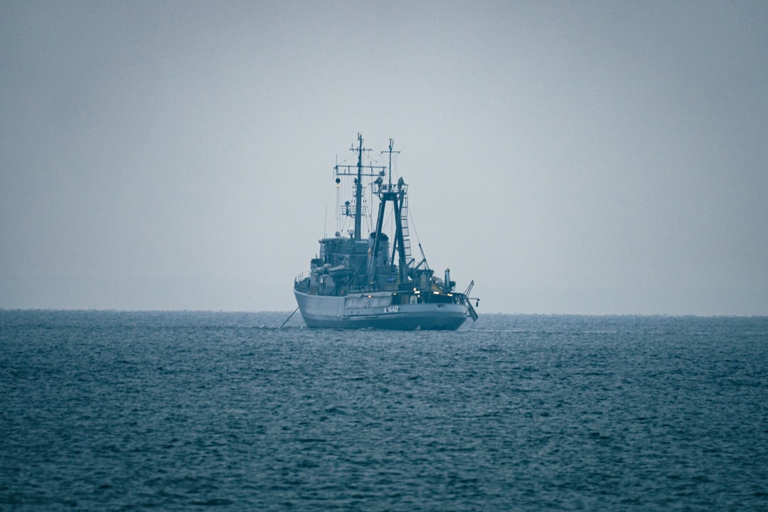A large ship sails on the open ocean.
